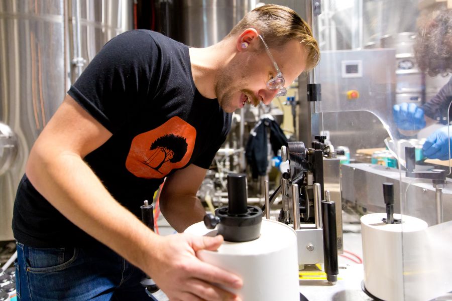 Darren Binnena at the labeling machine