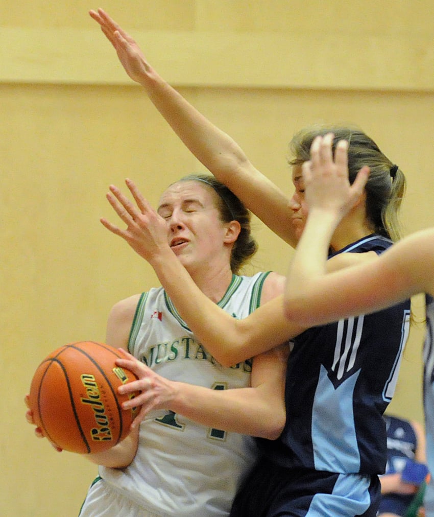 <who>Photo Credit: Lorne White/KelownaNow </who>Immaculata's Ashlyn Day, left, scored 30 points for a second straight night, but it wasn't enough as the Mustangs fell to the Vernon Panthers in semifinal play.