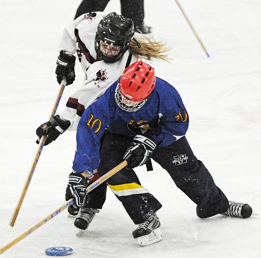 <who>Photo Credit: Lorne White/KelownaNow </who>Vernon's Dayce Knopf, foreground, battles the Heat's Maia Johnston for possession of the ring.