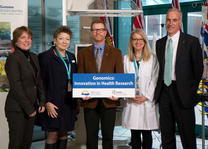 <who> Photo Credit: Province of British Columbia on Flickr. </who> B.C. Health Minister Terry Lake (centre) announced added funding for Genome BC on Tuesday.