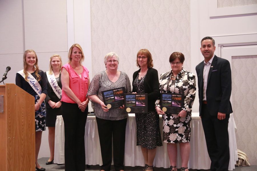 <who>Photo Credit: KelownaNow</who> Mayor Basran with the finalists for the Woman of the Year award