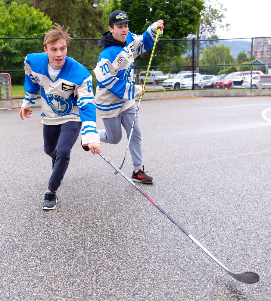 <who>Photo Credit: NowMedia/Gord Goble</who> Bradly and Josh Nadeau flash the ball hockey skills at a Discovery House event