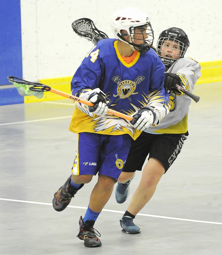 <who>Photo Credit: Lorne White/KelownaNow </who>Julia Diemand, right, of the Kodiaks goes on the defence against the Kamloops Rattlers in the tournament final.