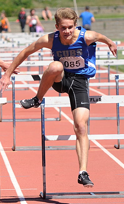 <who>Photo Credit: Lorne White/KelownaNow </who>Noah Russell of Const. Neil Bruce hurdled to two Valley medals.