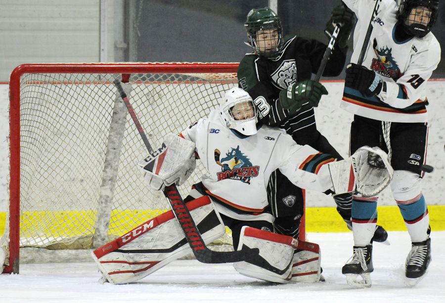 <who>Photo Credit: Lorne White/KelownaNow </who>The Okanagan Rockets' Wilson Maxfield is knocked over by an Everett Silvertip in the championship game. Maxfield was selected as the all-star goaltender, finishing with a 0.67 goals-against average in three games. 