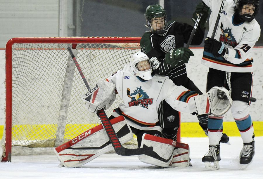 The Okanagan Rockets' Wilson Maxfield is knocked over by an Everett Silvertip in the championship game. Maxfield was selected as the all-star goaltender, finishing with a 0.67 goals-against average in three games.