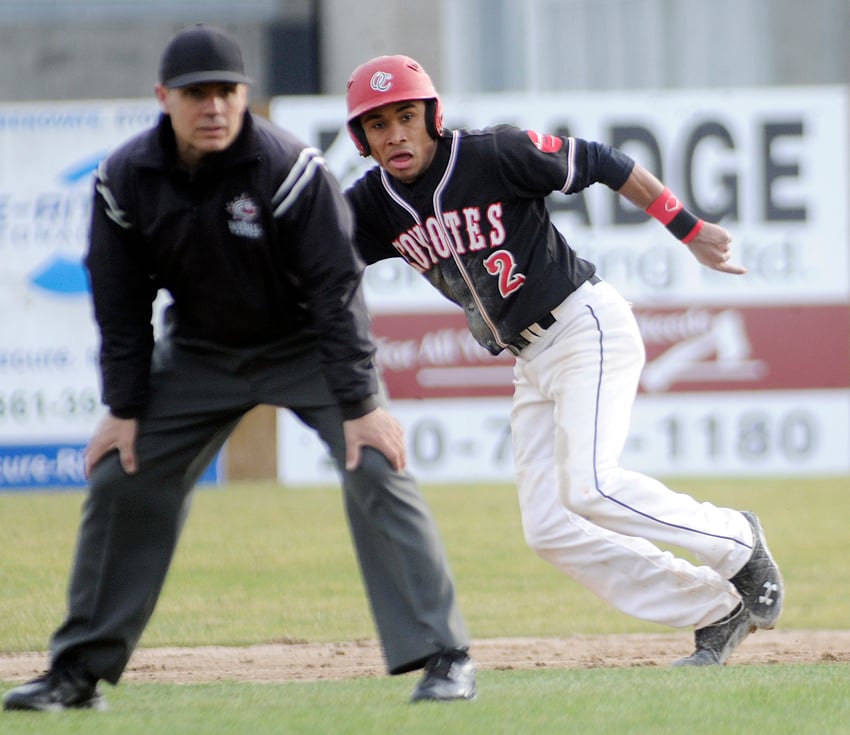 <who>Photo Credit: Lorne White/KelownaNow </who>Erick Junnola of the Coyotes heads for third base in Saturday's second game against the visiting PBA Dawgs.