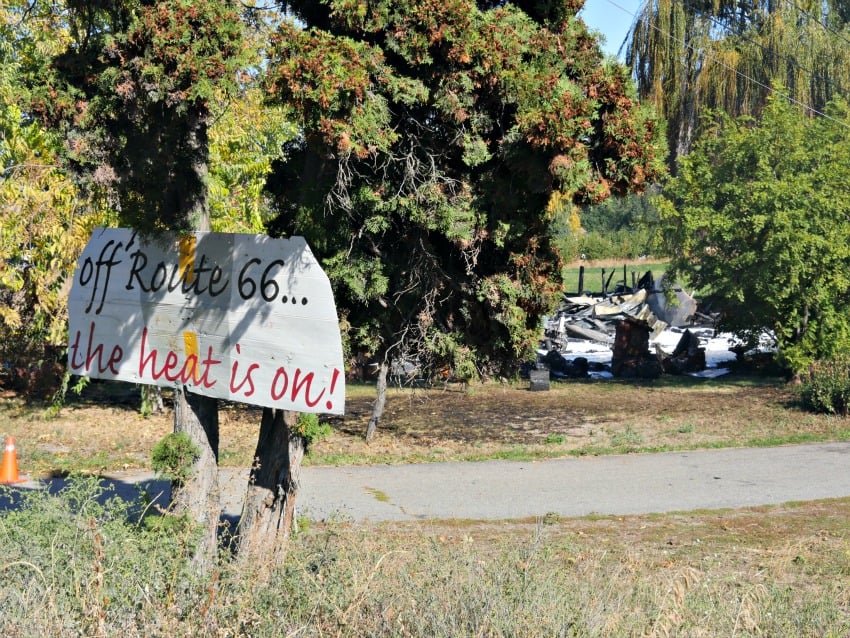 <who> Photo Credit: KelownaNow.com </who> This sign marks the property where the fire took place.