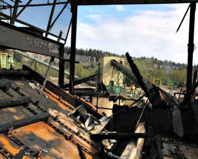 <who> Photo Credit: WorkSafeBC. </who> Part of the mill after the fire. 