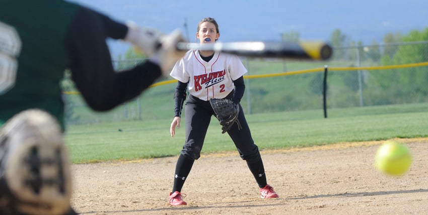 <who>Photo Credit: Lorne White/KelownaNow </who>The Kelowna Heat's Tatiana Brazinha gets set to defend on a swing by a Sherwood Park batter in their U18 tournament game on the weekend.
