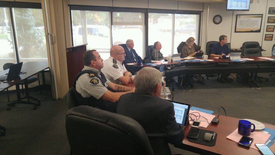 <who>Photo Credit: PentictonNow </who>Supt. Ted De Jager, commander of Penticton and South Okanagan Similkameen RCMP, made his quarterly presentation to the RDOS Board Thursday. Keremeos Mayor Manfred Bauer and Summerland Mayor Peter Waterman told De Jager they would not support any centralized hub policing model that would operate out of Penticton.
