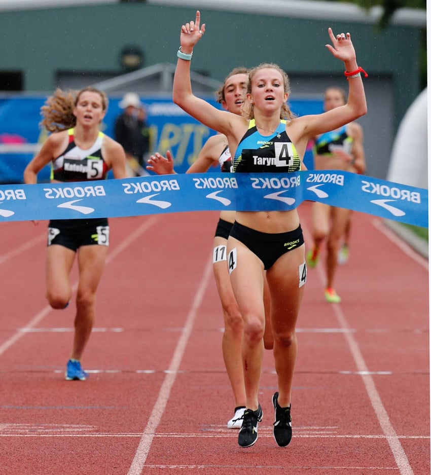 <who>Photo Credit: Margot Kelly/Photography LLC </who>Taryn O'Neill of Lake Country crosses the finish line of the two-mile race at the Brooks PR Invitational in Seattle.