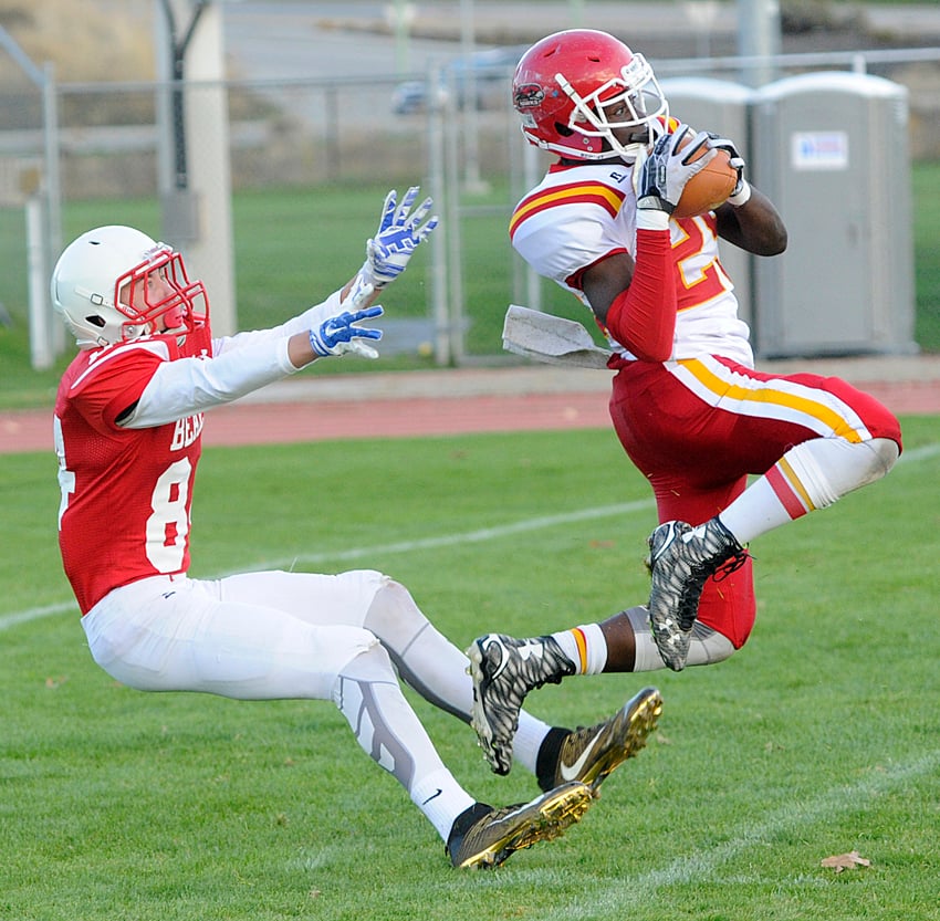 <who>Photo Credit: Lorne White/KelownaNow </who>Nelson Lokombo of the W.J. Mouat Hawks intercepts a Taylor Knoll pass intended for the Boucherie Bears' Steven Johnson in the first half of their game on Friday at the Apple Bowl.