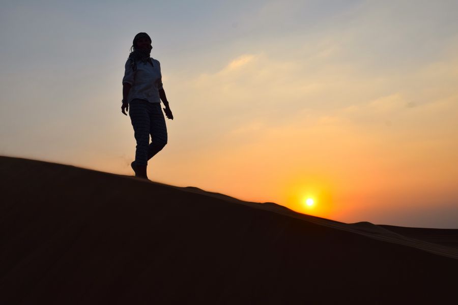 </who>A break from dune bashing to admire the desert sunset.
