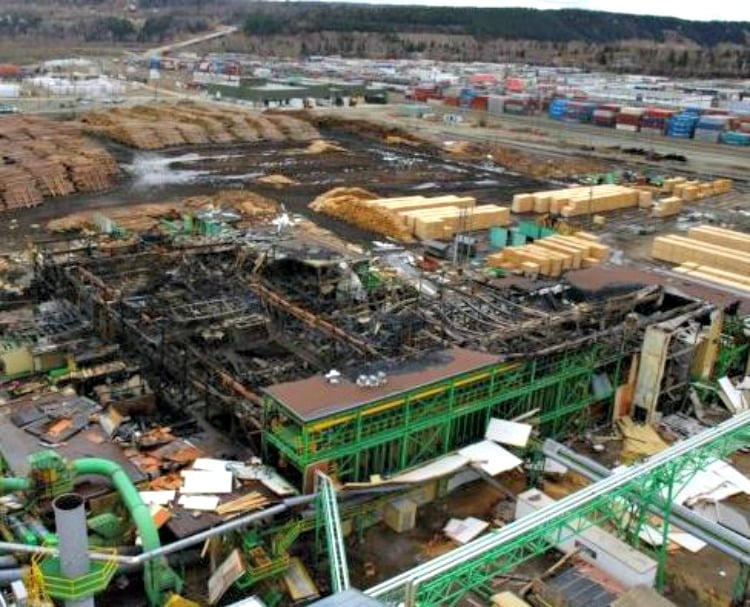 <who> Photo Credit: WorkSafeBC. </who> View of the mill after the fire. 