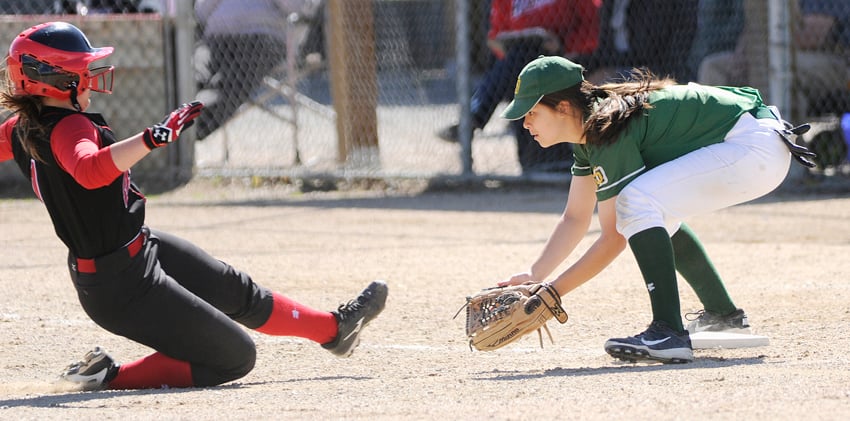 <who>Photo Credit: Lorne White/KelownaNow </who>Haley Martin of the Kelowna Heat is thrown out attempting to steal third base against the South Delta Invaders.
