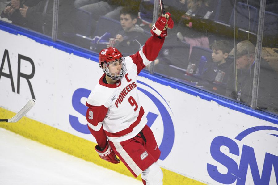 Jason Cotton celebrates a goal scored at Sacred Heart University.