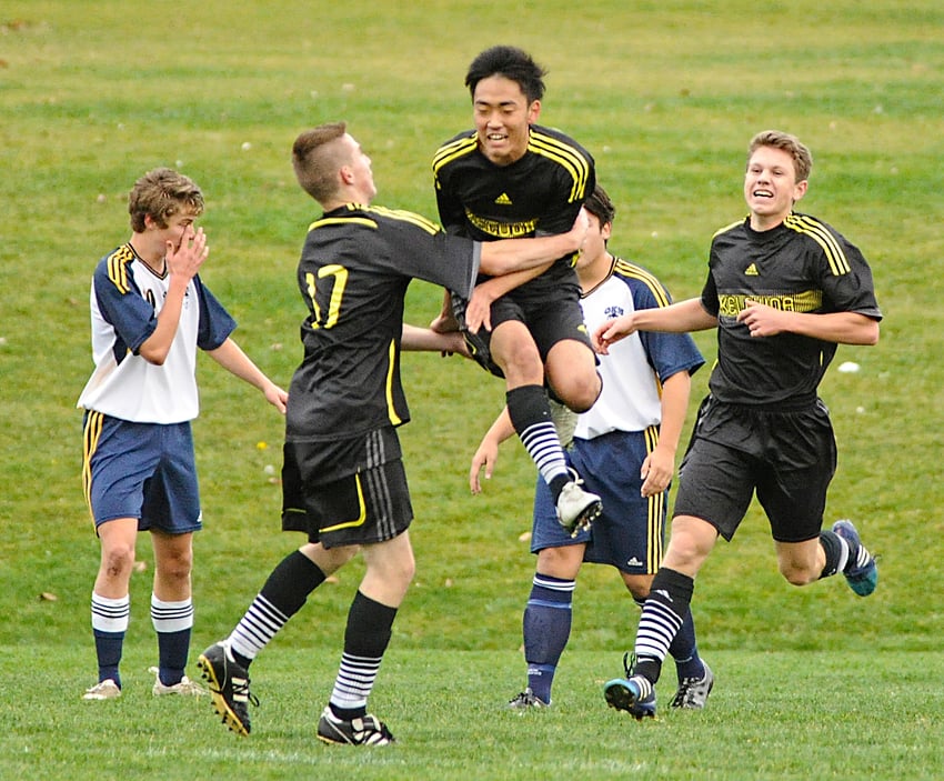 <who>Photo Credit: Lorne White/KelownaNow </who>Jay Park of the Kelowna Owl leaps in celebration of his goal in an Okanagan Valley senior AAA soccer match against the host Okanagan Mission Huskies this week at OKM. Joining in are teammates Taylor Piche, left and Edvin Holok.
