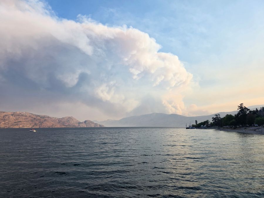 <who>Photo Credit: BC Wildfire Service</who>A view of the fire activity looking down Okanagan Lake from the Kelowna area.