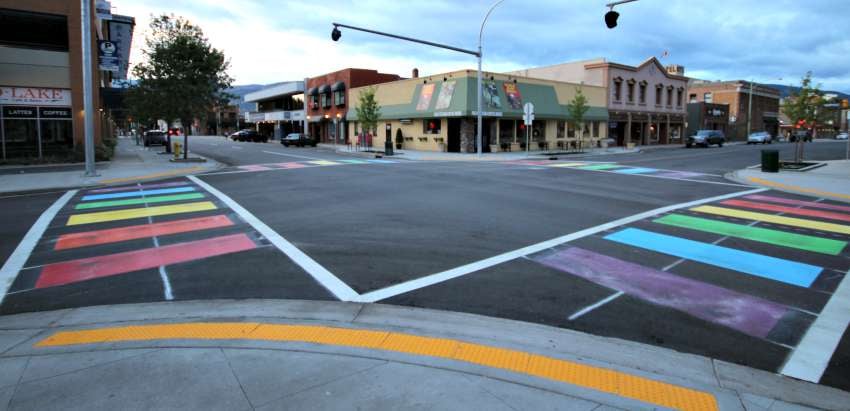 <who> Photo Credit: Contributed </who> Rainbow sidewalks in downtown Kelowna, at the intersection of Lawrence Avenue and Pandosy Street. 