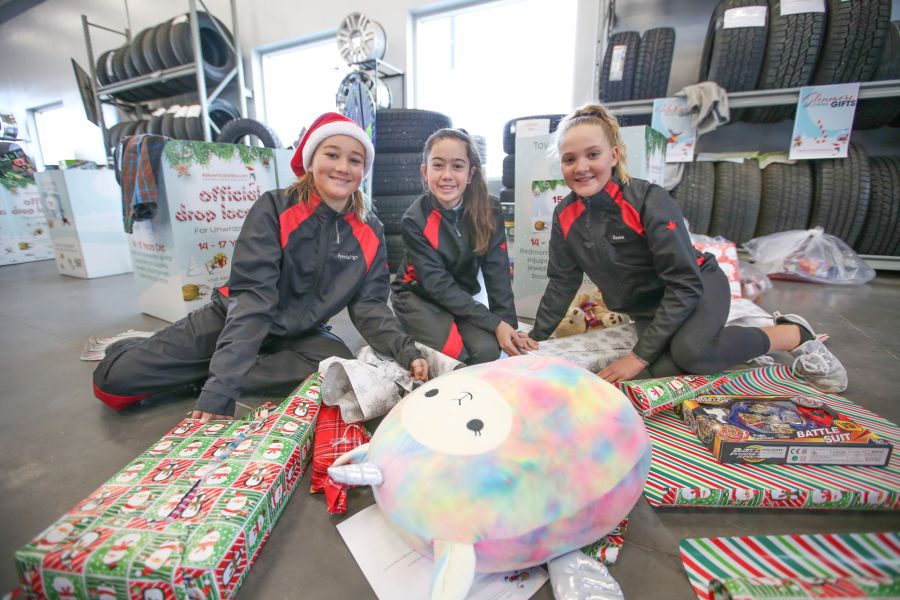 Dozens of community members turn up to wrap and deliver gifts for families in need!