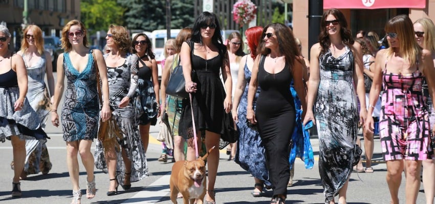<who> Photo Credit: KelownaNow. </who> Jackson (centre) with about 60 of her loyal customers on Bernard Avenue in Kelowna. 