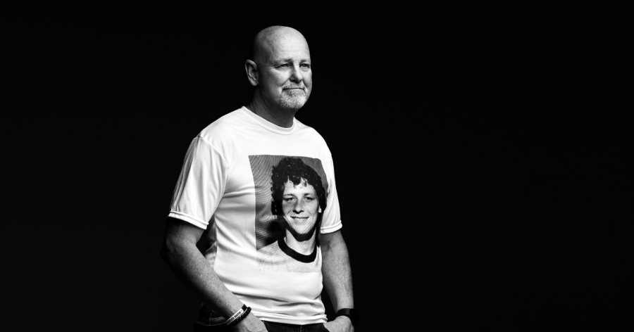 <who> Photo Credit: Terry Fox Foundation </who> Fred Fox, wearing a shirt with the image of Terry on it. 