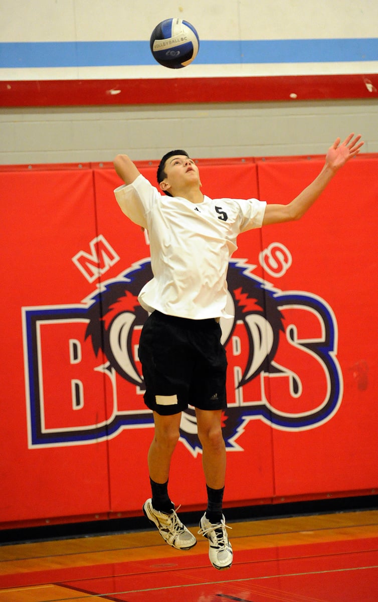 <who>Photo Credit: Lorne White/KelownaNow </who>George Elliot's Ben Magel serves to MEI in the provincial semi. He was named the tournament's most valuable player.