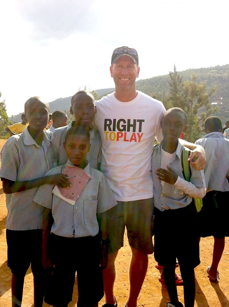 <who> Photo Credit: UBC Okanagan </who> UBC Assist. Prof. Stephen Berg with school children in Rwanda. 