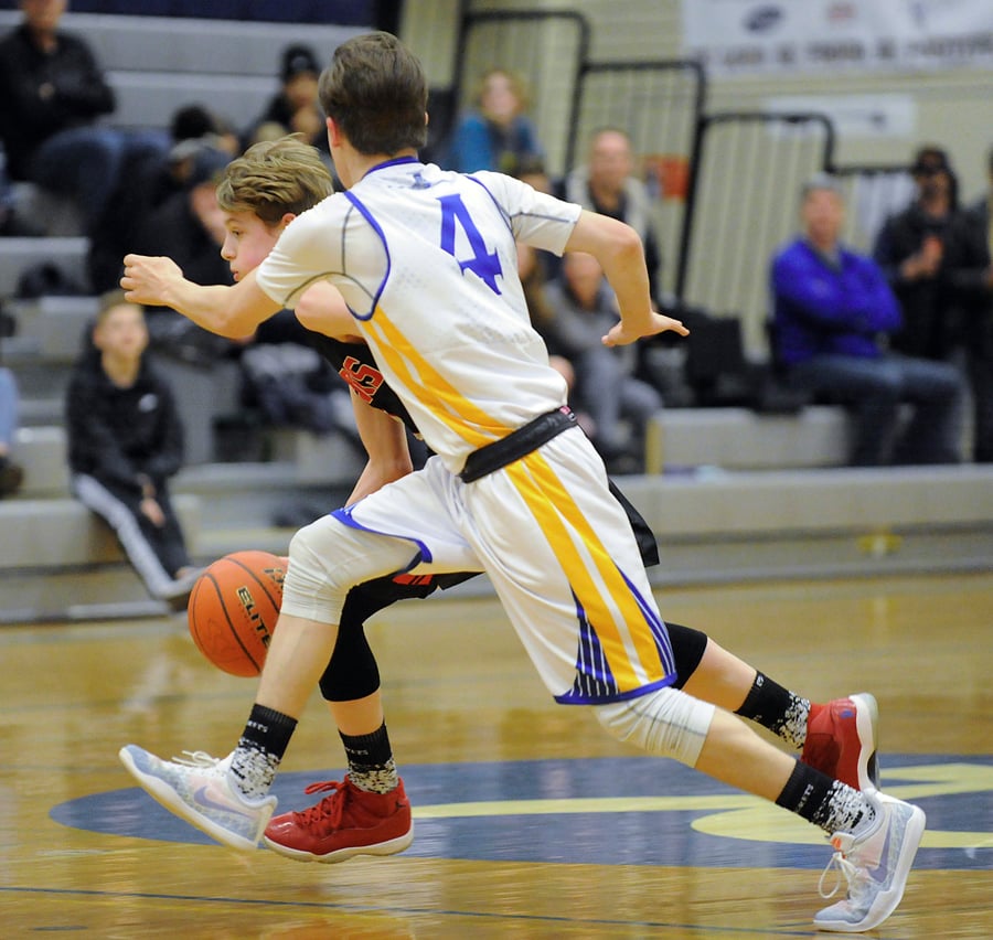 Josh Clancy of the Mt. Boucherie Bears makes his move to the hoop against Rutland's Nate Ringness-Law.
