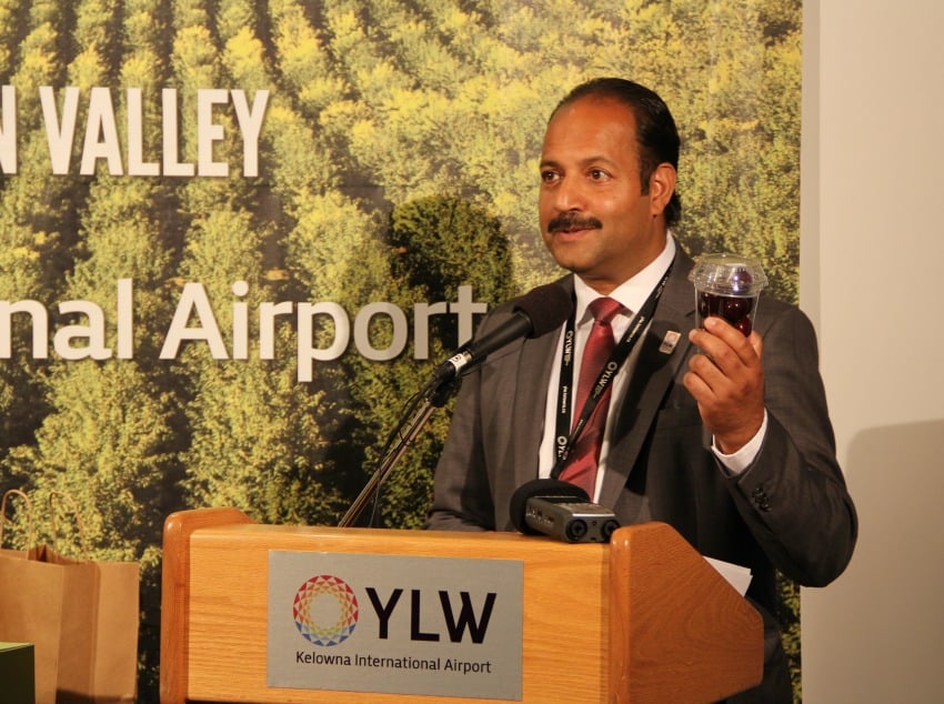 Airport director Sam Samaddar showing off the plane-ready produce.