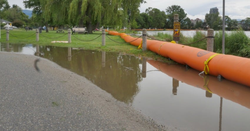Lake water beginning to seep underneath barriers