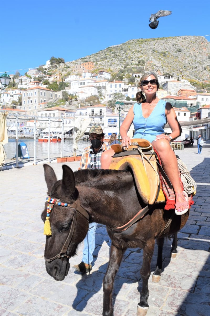 </who>Kerry MacNaull enjoys a donkey ride through the streets of the Greek island of Hydra.