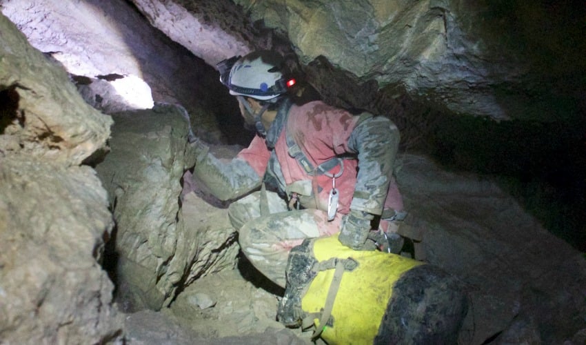 <who>Photo Credit: Jerome Genairon</who>Hauling packs is one of the most physically challenging aspects of caving.
