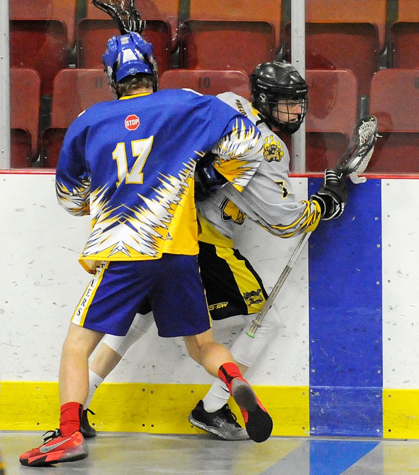 <who>Lorne White/KelownaNow </who>Colton Wasylenko of the Kodiaks is pinned to the boards by a Kamloops Rattler in the first period at Memorial Arena.