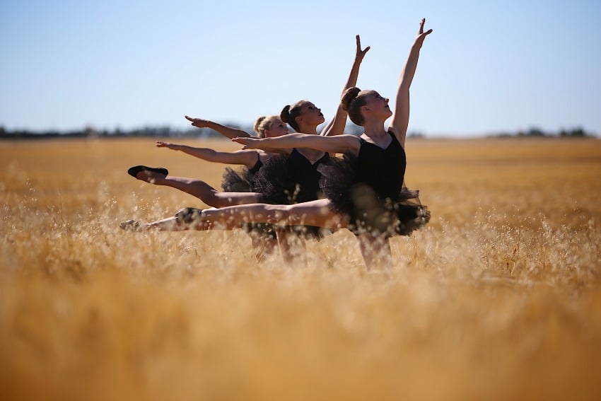 Photo Credit: Sarah Thorpe. </who> Dancers perform on the set of Late Harvest in Lloydminster, Alta.
