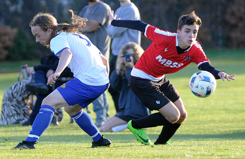 <who>Photo Credit: Lorne White/KelownaNow </who>Yves Vercosa, right, of the Mt. Boucherie Bears chases down a through ball ahead of Rutland's Wesley Turcot.