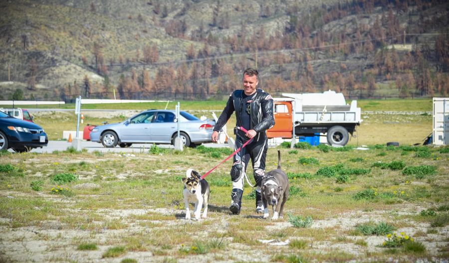 <who>Photo Credit: Anett Meszaros</who>Tom Dennehy with his two dogs.