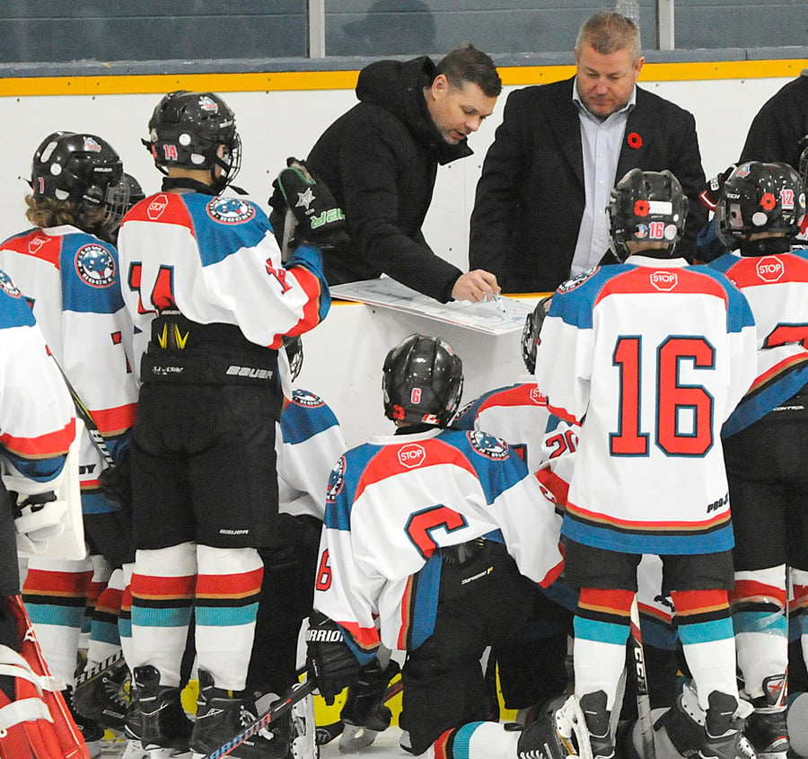 <who>Photo Credit: Lorne White/KelownaNow </who>Coaches Bryron Ritchie, left, and Jason Tansem share strategy during a recent peewee tournament in Kelowna.