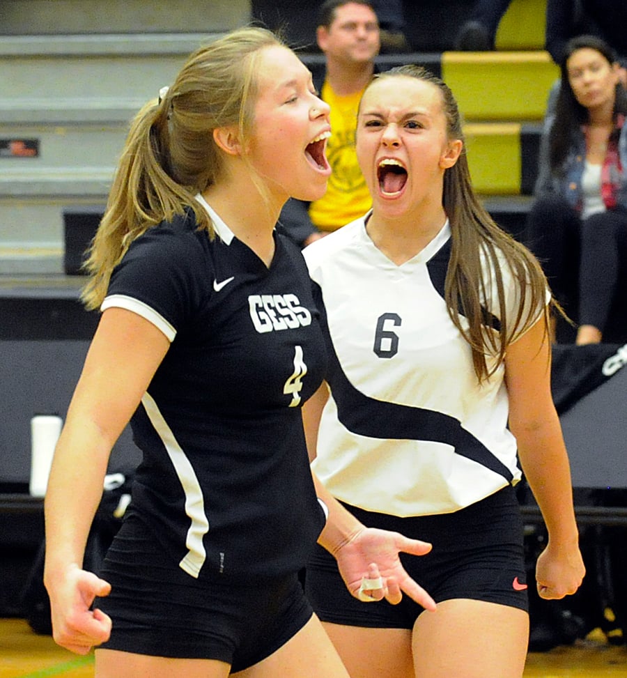 <who>Photo Credit: Lorne White/KelownaNow </who>Jasanna Kunz, left, and Jessye Large of the Coyotes celebrate a big point in a big way against the Owls.