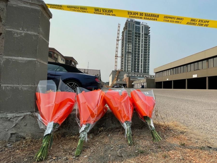 </who>Flowers near the site for the four construction workers.