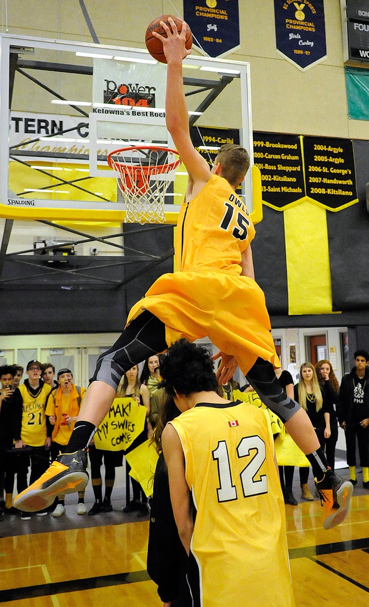 <who>Photo Credit: Lorne White/KelownaNow </who>The Owls' Grant Shephard won the slam dunk contest with this leap over three schoolmates.