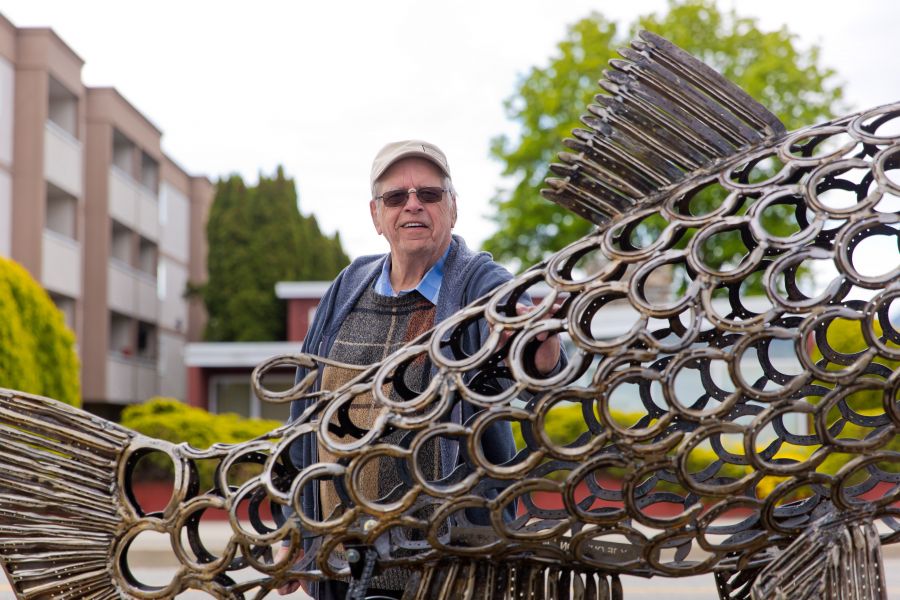 <who>Photo Credit: NowMedia/Gord Goble</who> Jean Ouellon in 2022 with his 'Pearl the Pandemic Salmon''