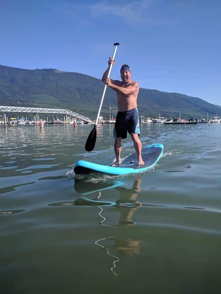 <who> Photo credit: Contributed </who> Platz on his paddle board (on a different occasion).