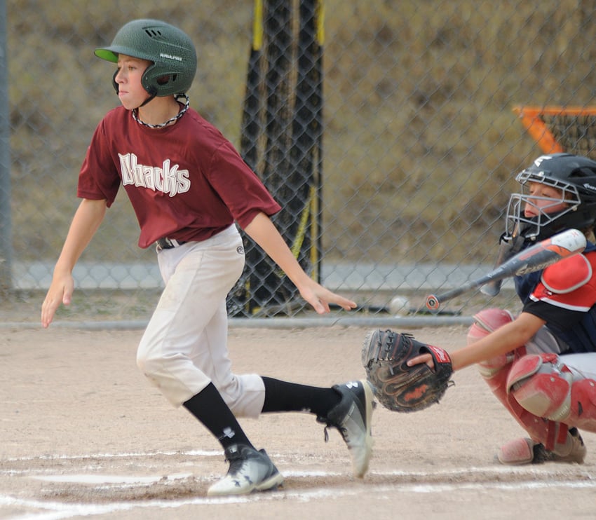 <who>Photo Credit: Lorne White/KelownaNow </who>Jacob Johnson of the Bbacks follows through on a hit ball (single) against the Prince George Knights.