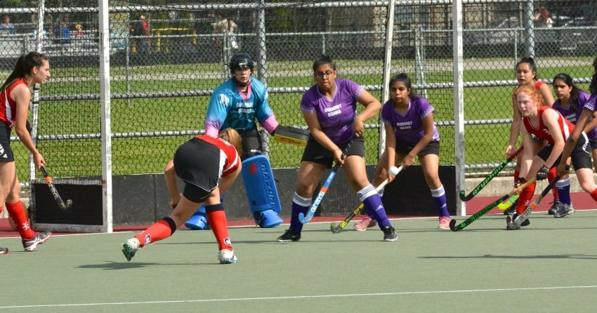 <who> Photo Credit: Submitted </who> L to R: Grace Demug, Izzy Seifert, Lonica McKinney up against Burnaby.