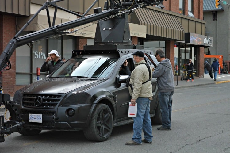 <who> Photo Credit: KamloopsBCNow </who> Crews set up for a shot on 4th Ave. in downtown Kamloops.