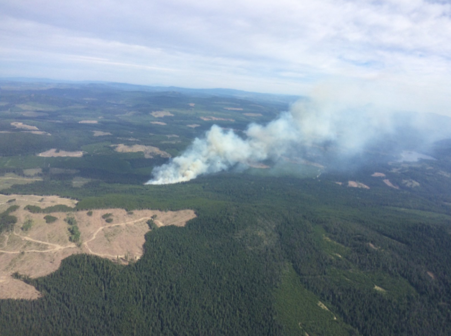 <who> Photo Credit: BC Wildfire Service </who> The fire burning near Jackpine Lake.