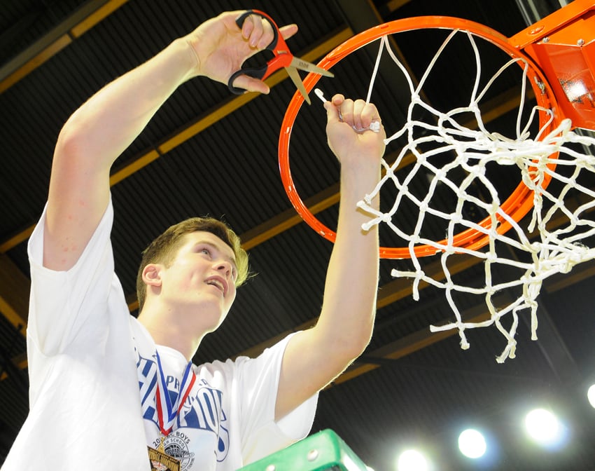 <who>Photo Credit: Lorne White/KelownaNow.com </who>Spencer Braam and his Owls teammates followed the net-cutting tradition after their provincial win.