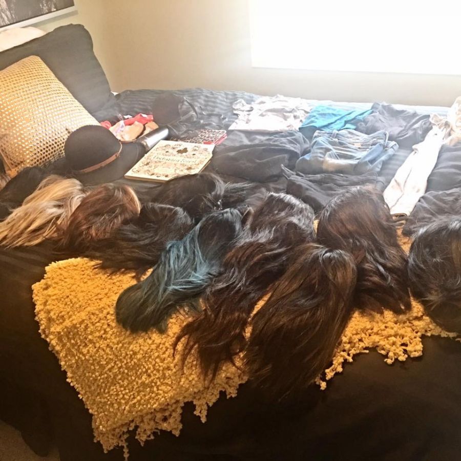 <who> " I made sure I packed ALL 11 of my wigs!...😂 but not one piece of documentation other than my passport lol," said Amanda Greenough.